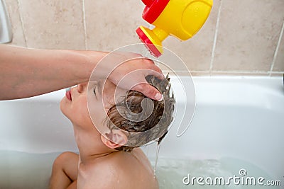 Toddler getting a hair wash Stock Photo