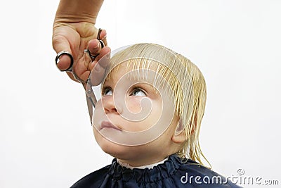 Toddler getting haircut Stock Photo