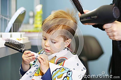 Toddler getting a haircut Stock Photo