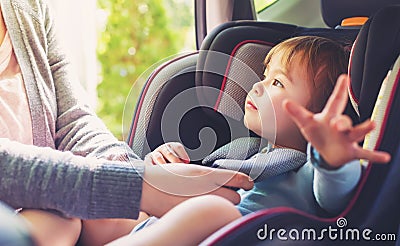 Toddler girl in her car seat Stock Photo