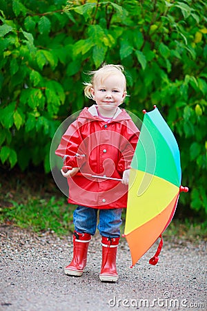 Toddler girl with umbrella Stock Photo