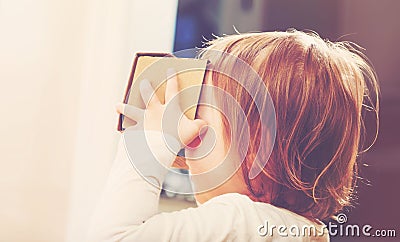 Toddler girl using a virtual reality headset Stock Photo