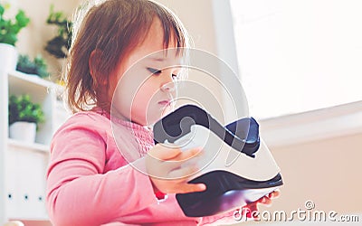 Toddler girl using a virtual reality headset Stock Photo