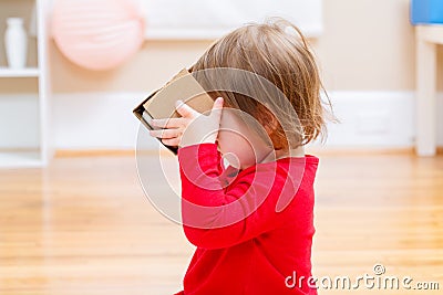 Toddler girl with virtual reality headset Stock Photo