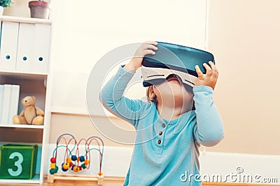 Toddler girl with virtual reality headset Stock Photo