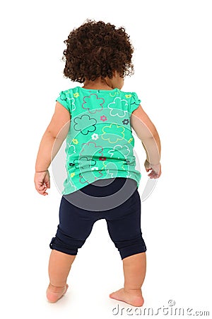 Toddler Girl Walking Away Stock Photo