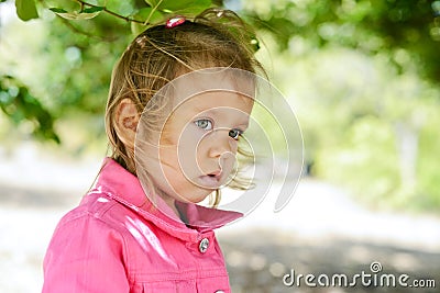 Toddler girl in windy weather Stock Photo