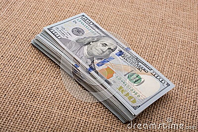 Toddler hand holding banknote bundle of US dollar in hand Stock Photo