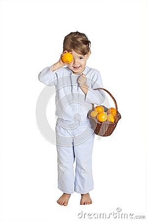 Toddler holding basket of oranges, clipping path Stock Photo