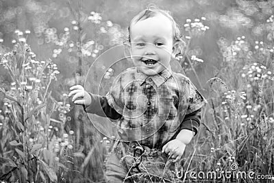 Toddler laughing in nature Stock Photo