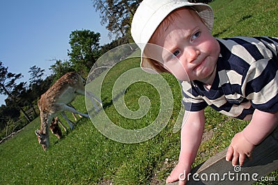 Toddler playing in countryside Stock Photo