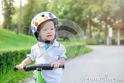 Toddler ridding balance bike Stock Photo