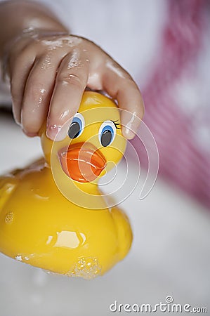 Toddler with rubber ducky Stock Photo