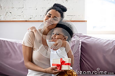 African son makes surprise to mom on Mothers day Stock Photo