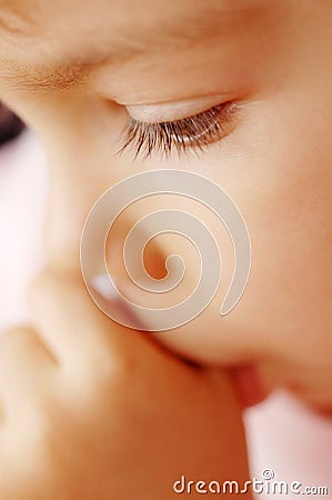 Toddler sucking thumb Stock Photo