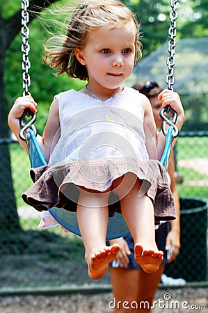 Toddler on swing Stock Photo