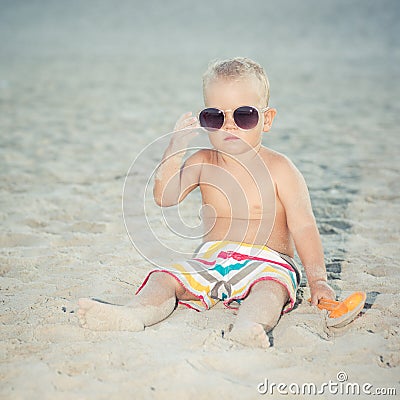 Toddler wearing oversized sunglasses Stock Photo
