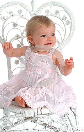 Toddler in Wicker Chair Stock Photo