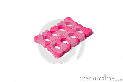 Toe separator isolated on a white background. Pair of toe separator in the form of small hearts. Spongy material Stock Photo