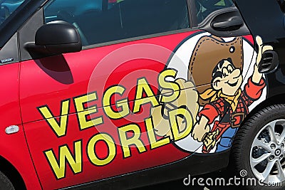 TOENISVORST, GERMANY - JUIN 28. 2019: Close up of logo of Vegas World german gambling hall chain on door of red car Editorial Stock Photo