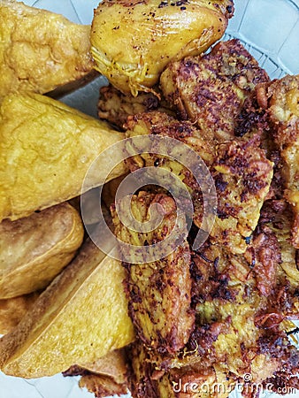 Tofu and fried tempeh with turmeric spices taste good, delicious and healthy Stock Photo