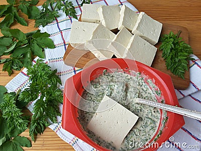 Tofu in green goutweed tempura, cooking organic food Stock Photo