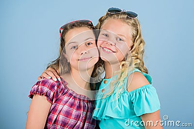 Togetherness. summer vacation. beauty and fashion. long blond curly hair. cheerful small girls in sunglasses. trendy Stock Photo