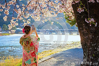 Togetsukyo bridge that crosses the Katsura River with scenic full bloom cherry blossom in spring Editorial Stock Photo