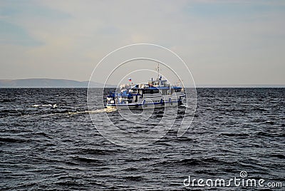 The river motor ship OM-357 sails along the Volga River on a suburban route. Editorial Stock Photo