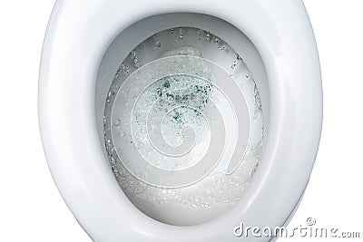 Toilet bowl is flushed with several liters of drinking water, waste of environmental resources in times of global climate warming Stock Photo