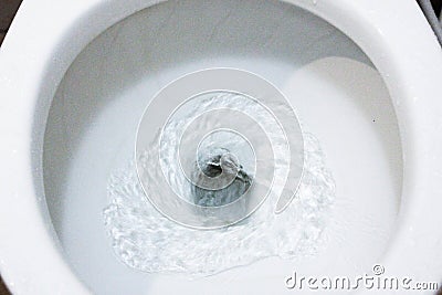 Toilet, Flushing Water, close up, water flushing in toilet Stock Photo