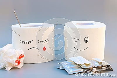 Toilet paper and pills. Concept of hemorrhoid treatment Stock Photo