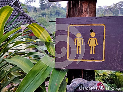 Toilet signpost in park. Stock Photo