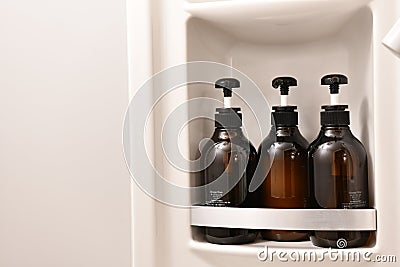 Toiletry bag with travel toiletries, small plastic bottles of hygiene products and soap, Hotel Guest Room Supplies Stock Photo