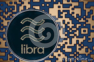 Token libra coin cryptocurrency on the background of gold crypto code Editorial Stock Photo