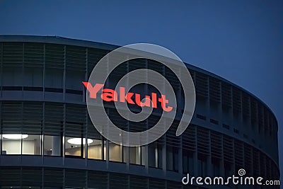 A Yakult building sign. A Japanese sweetened probiotic milk beverage fermented with the Editorial Stock Photo