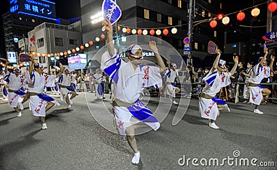 Tokushima, Japan - August 12, 2002: Male dancers perform fan dance at Awaodori street festival Editorial Stock Photo