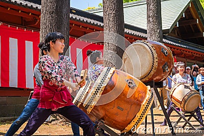 Japanese women perform Taiko drum in Bunkyo Azalea Festival Tsutsuji Matsuri at Nezu Shrine Editorial Stock Photo