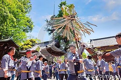 People parade through a street to Nezu-jinja shrine in Bunkyo Azalea Festival in Tokyo, japan Editorial Stock Photo