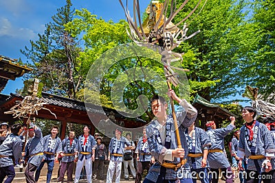 People parade through a street to Nezu-jinja shrine in Bunkyo Azalea Festival in Tokyo, japan Editorial Stock Photo