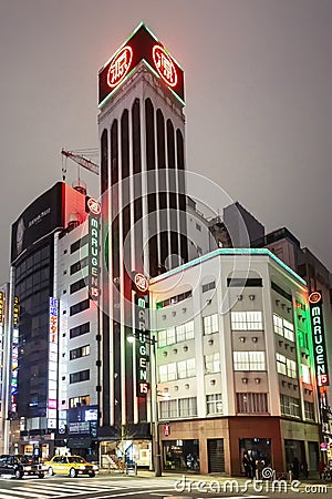 Tokyo, Japan, 04/04/2017: Asian night metropolis with beautiful buildings. Close-up. Editorial Stock Photo