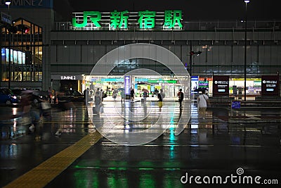 JR Shinjuku station viewed from Shinjuku Expressway Bus Terminal side in the rain Editorial Stock Photo