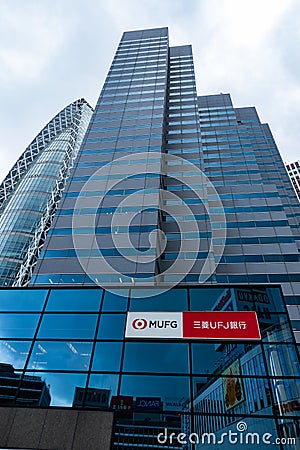 TOKYO, JAPAN - August 14, 2019 : Modern Office Building in Tokyo with MUFG Bank Logo infront of it. Straight lines in Structure Editorial Stock Photo