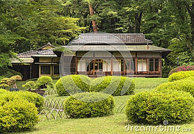 Niwaki shrubs and bonzai trees in front of the Kakuuntei teahouse in Meiji Jingu Inner Garden. Editorial Stock Photo