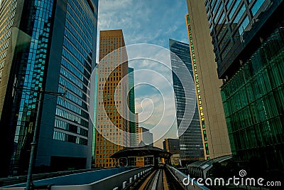 TOKYO, JAPAN JUNE 28 - 2017: Scenery of a train traveling on the elevated rail of Yurikamome Line in Odaiba, Minato Editorial Stock Photo