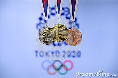 TOKYO, JAPAN, JUNE. 20. 2019 - Summer olympic Game, Tokyo 2020, logo of the games and medal - gold, silver and bronze Editorial Stock Photo