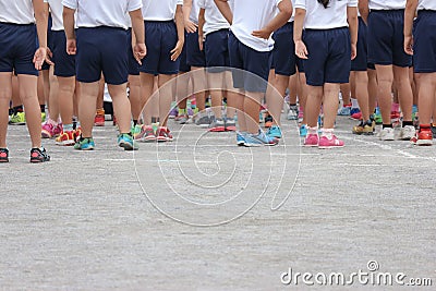 2017 OCTORBER 01. TOKYO JAPAN. legs of Japanese primary school students are in the row to prepare for sport day at public park Editorial Stock Photo