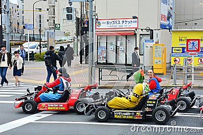 Tokyo, Japan - March 7, 2018 : Street kart tour, Mario kart tour is tourists dress up in superhero character costume and driving Editorial Stock Photo