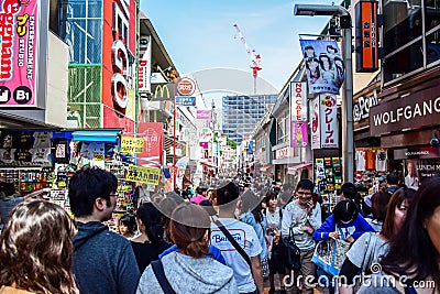 TOKYO, JAPAN: People are shopping at Takeshita street, a famous shopping street lined with fashion boutiques, cafes an Editorial Stock Photo