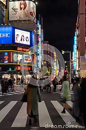 Slow exposure of pedestrian traffic in Shinjuku area of Tokyo, Japan Editorial Stock Photo